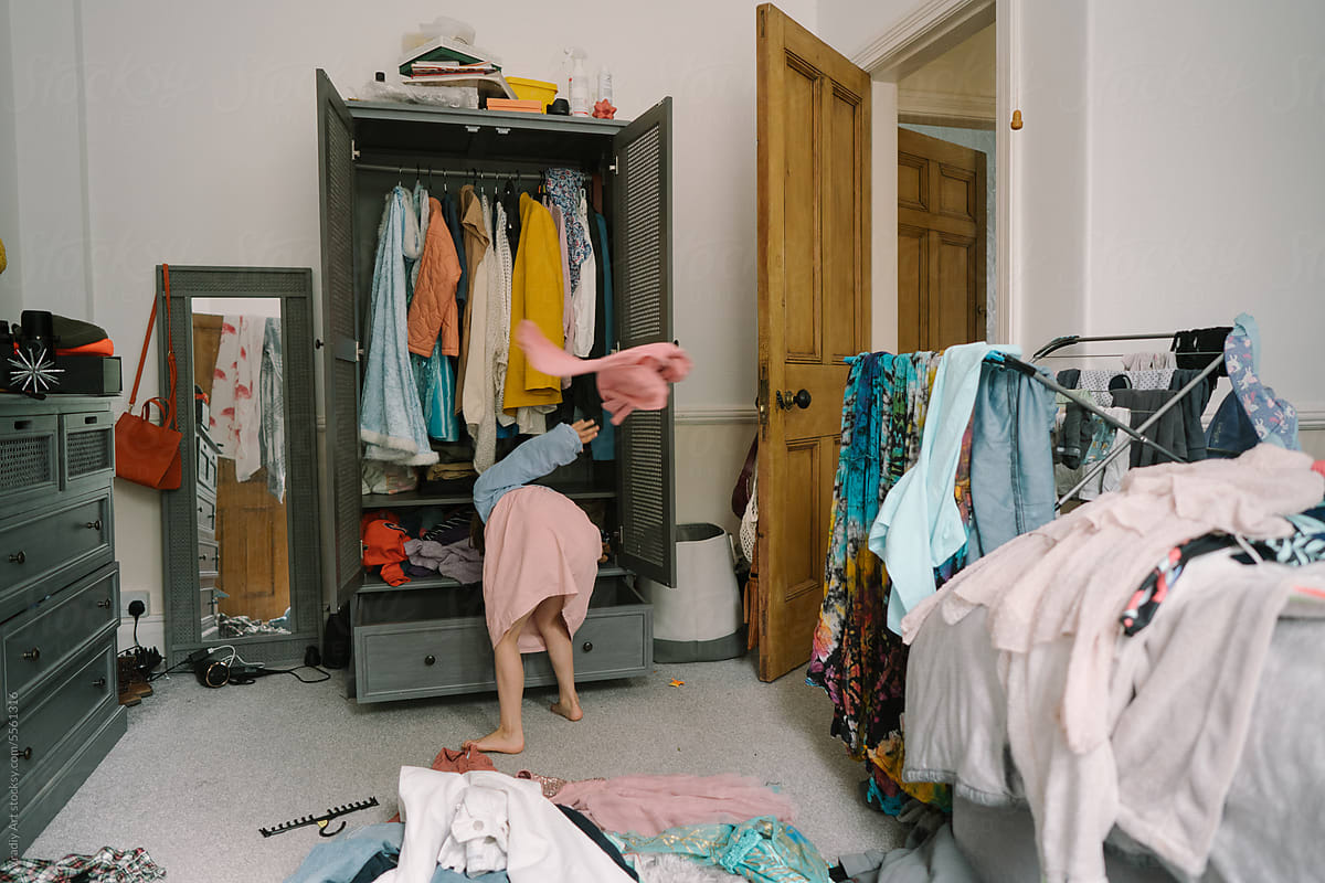 Little girl in the wardrobe room