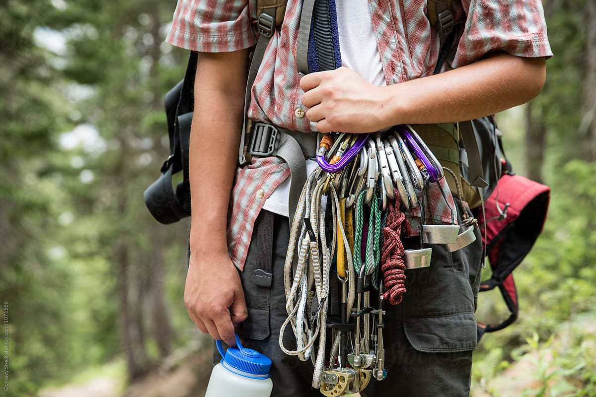 Young Man Carrying Mountaineering Equipment