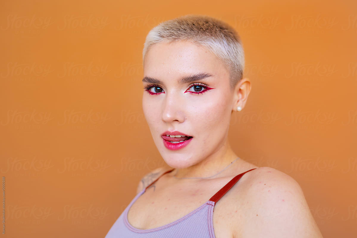 Young androgynous model with short blond hair