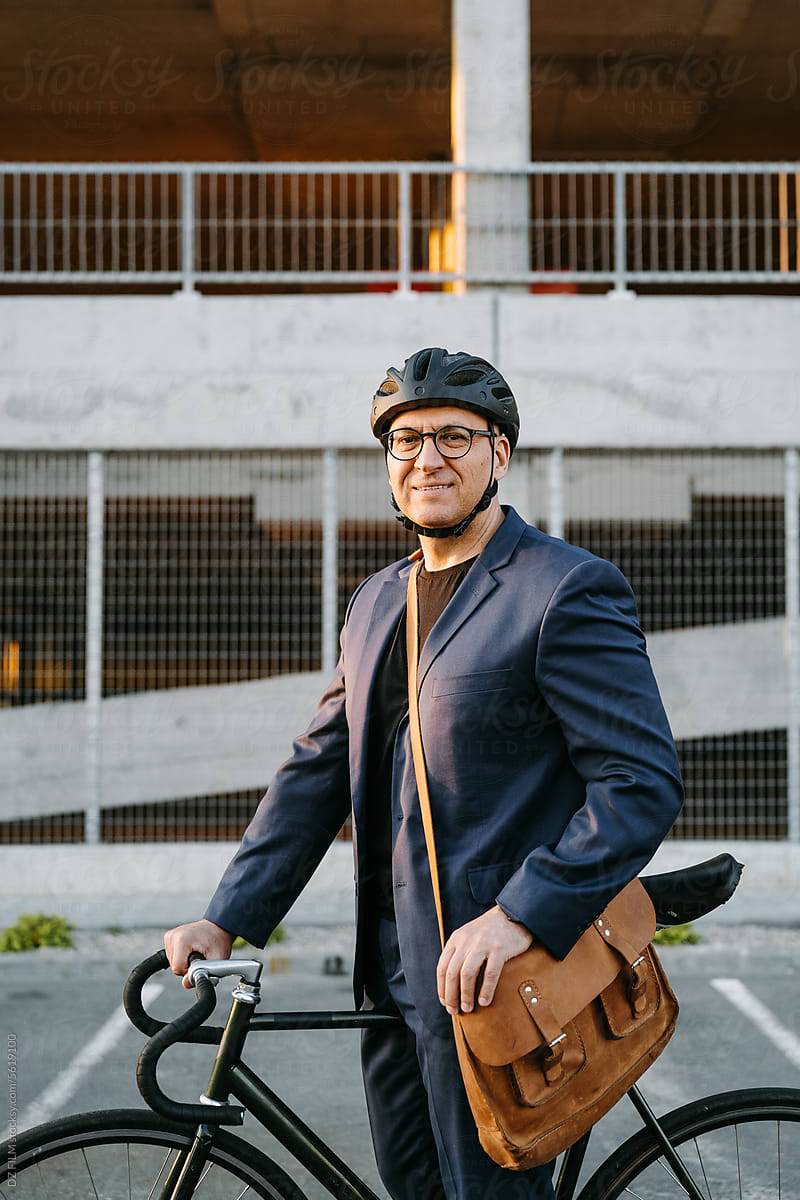 A man with a bicycle on a city street