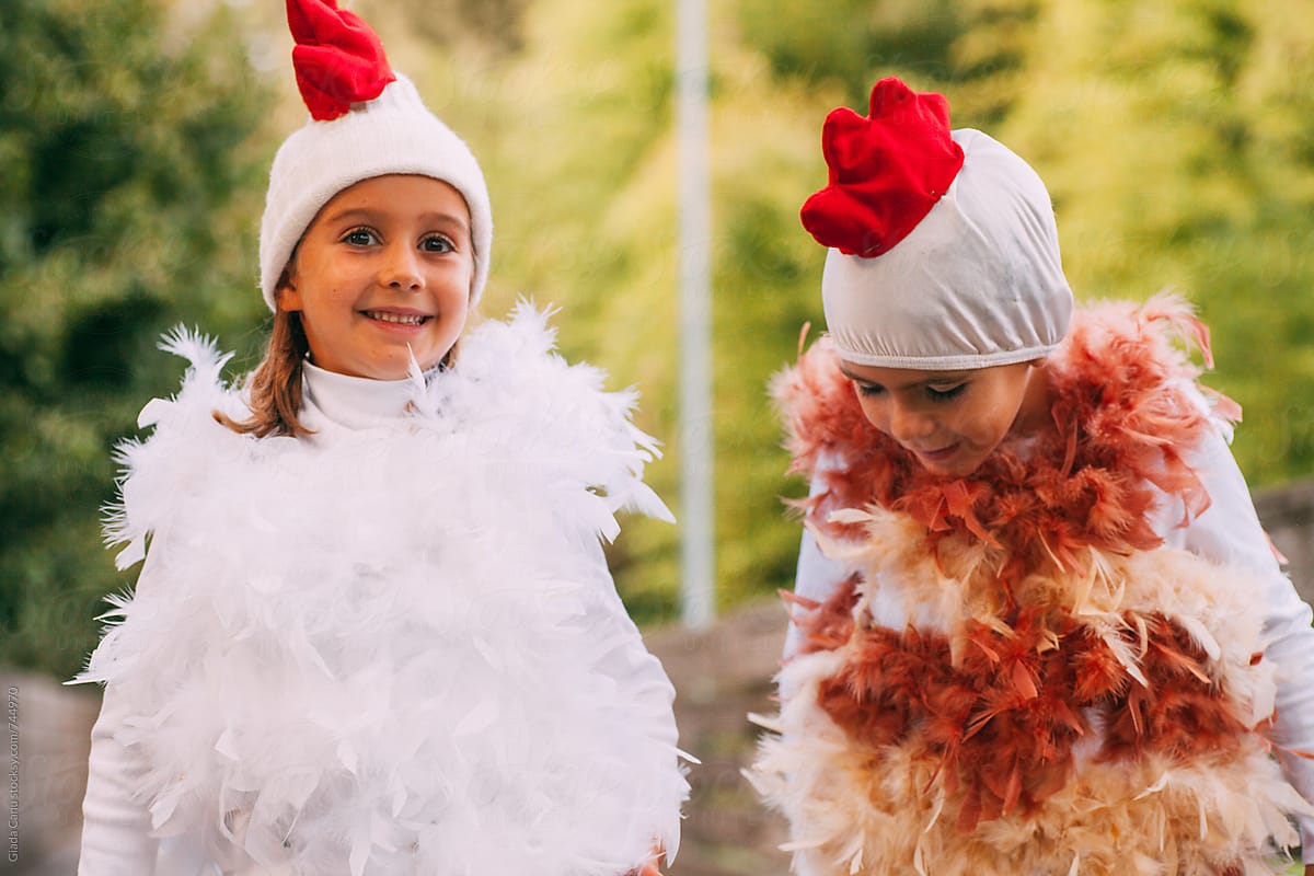 a boy and a girl dressed for Halloween as chickens