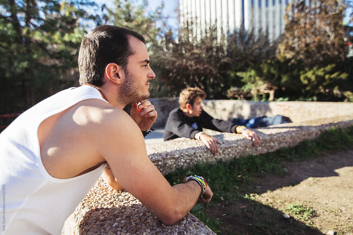 Two men resting during a parkour training