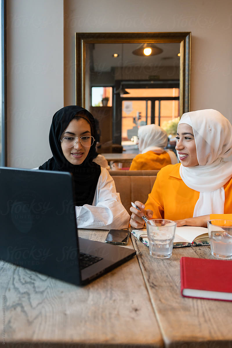 Muslim Women Using The Laptop.