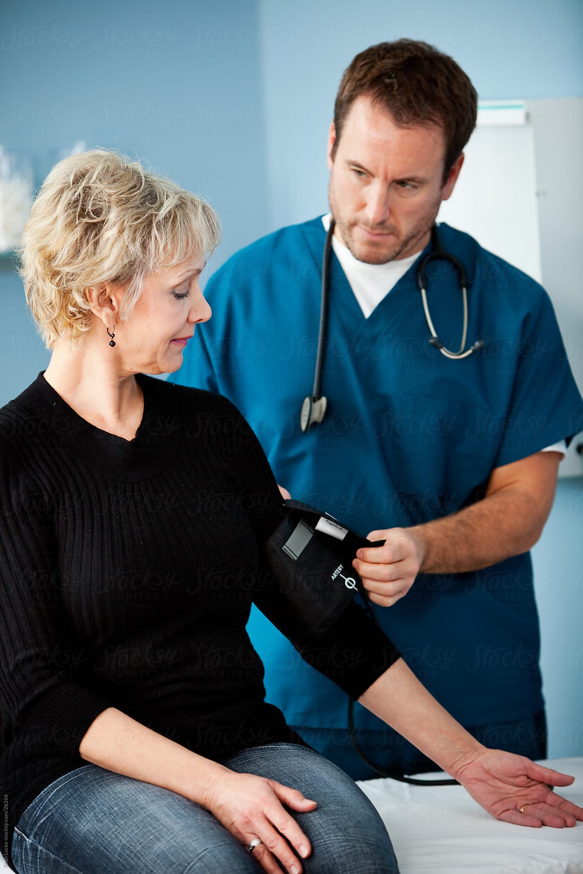 Exam Room: Mature Woman Gets a Blood Pressure Reading