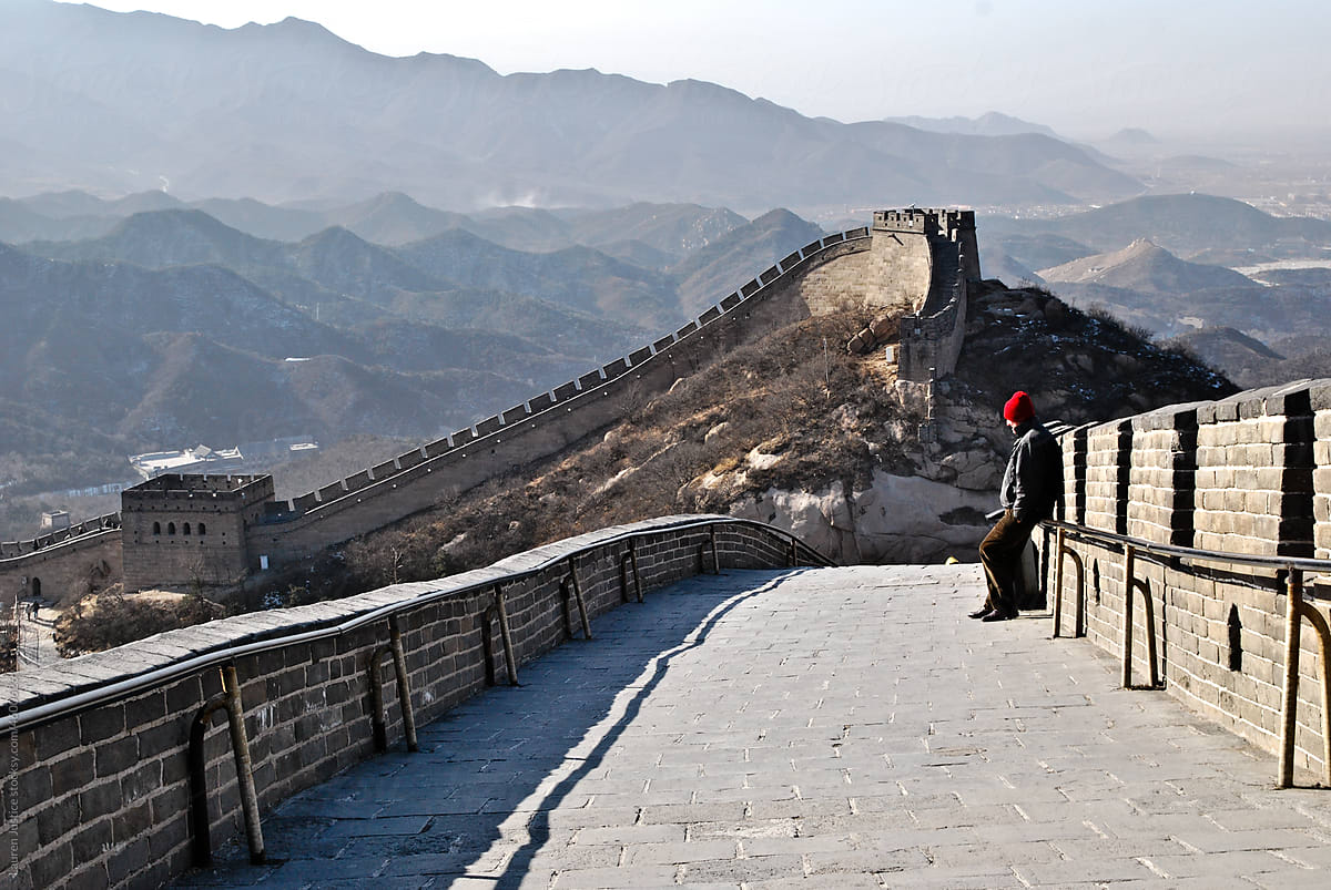 A man stands on The Great Wall of China