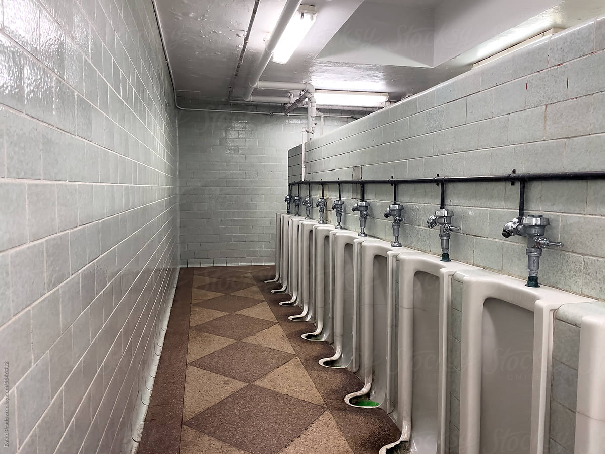 Empty toilet with ceramic urinals