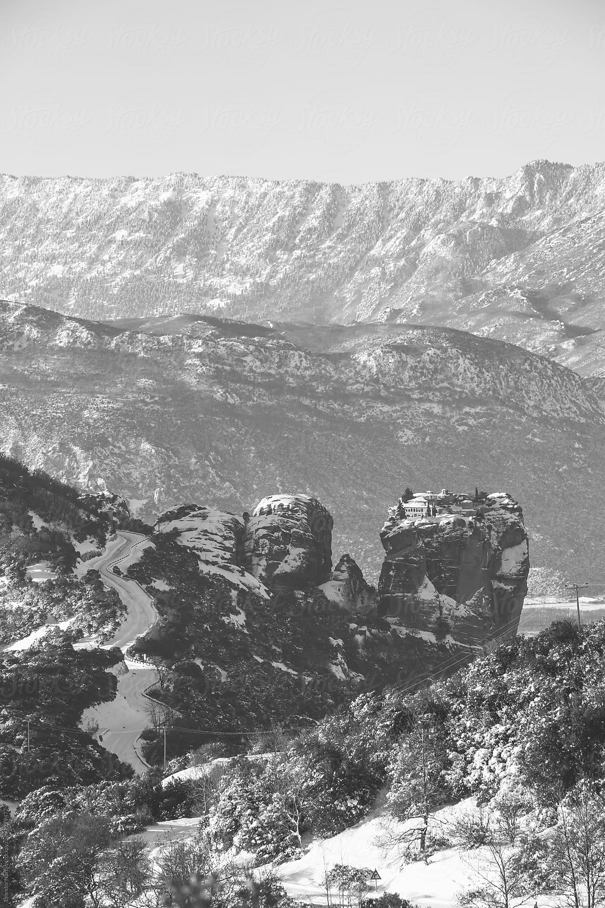 road up to holy trinity monastery in snowcovered meteora - black and white
