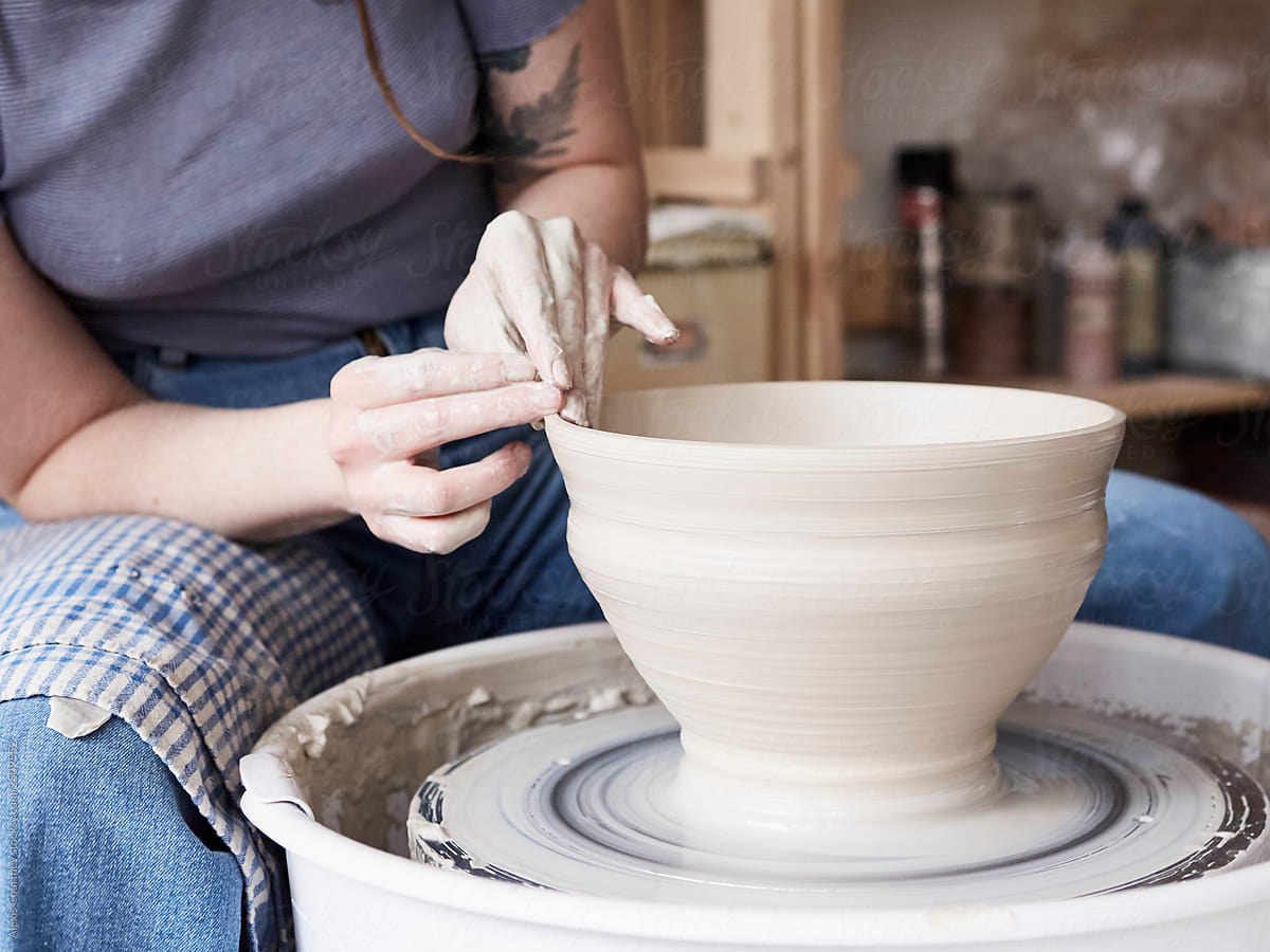 Potter throwing a large bowl on the potters wheel