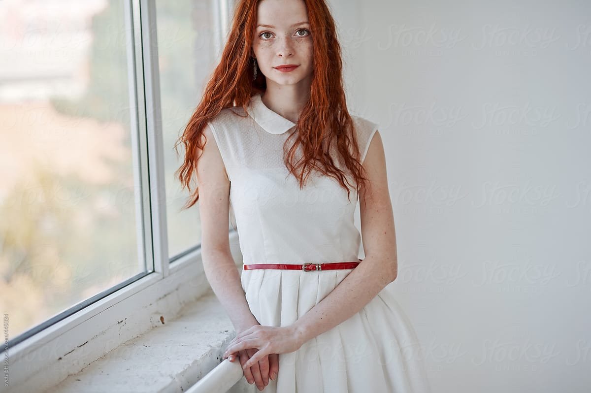 Red-haired In A White Dress" by Stocksy Contributor "Sveta SH"