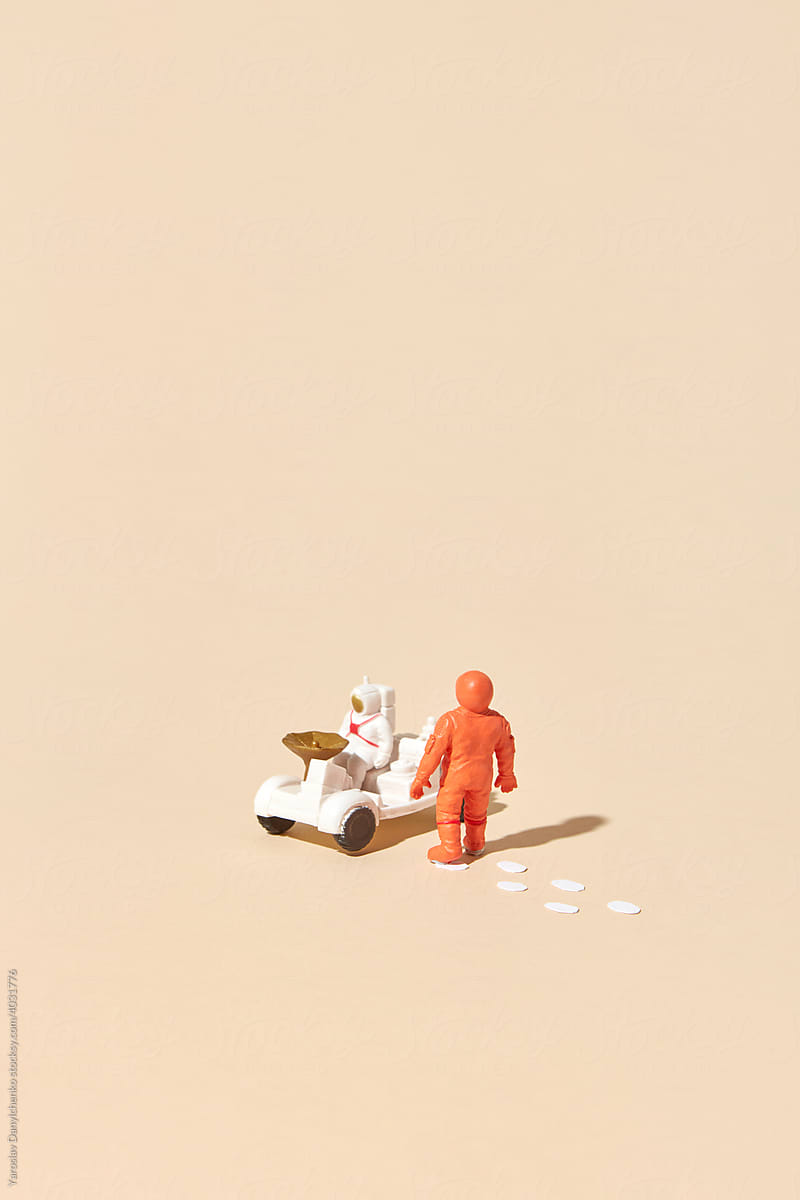 Cosmonauts riding space rover