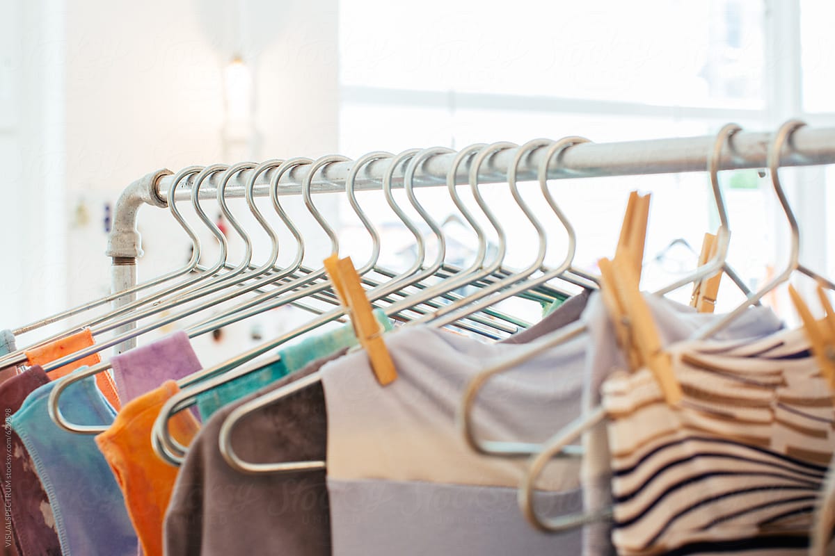A Clothing Rack With Many Clothing Hangers