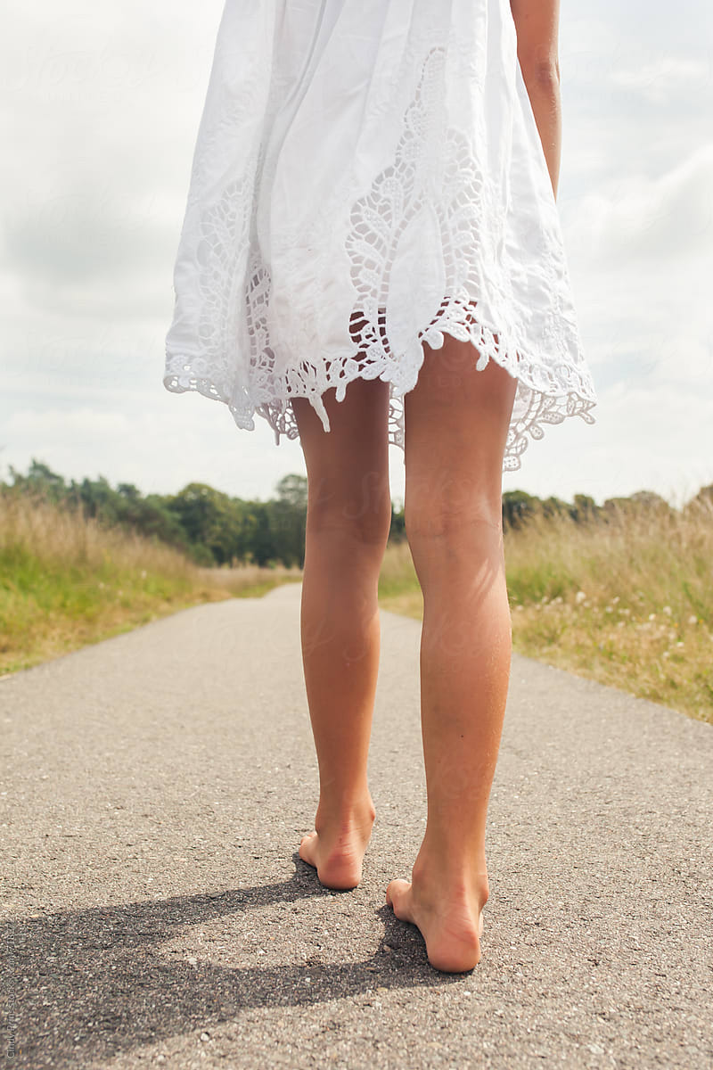 Bare Feet And Legs Of A Babe Girl In A White Dress By Stocksy Contributor Cindy Prins