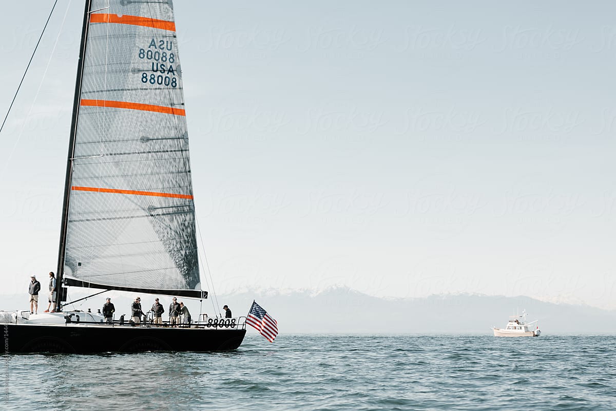 sailboat with American flag on end in the ocean for yacht race