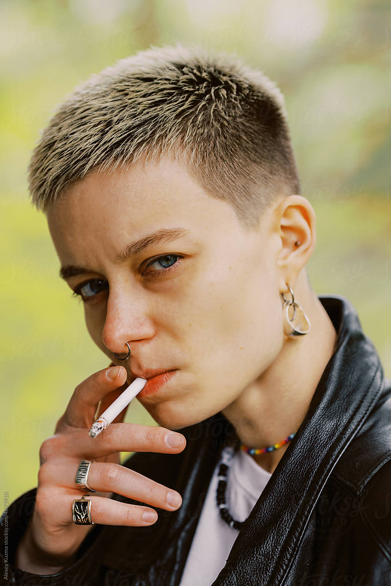 lesbians smoking cigarettes Two young inside a car Stock Photo two women lighting each other's
