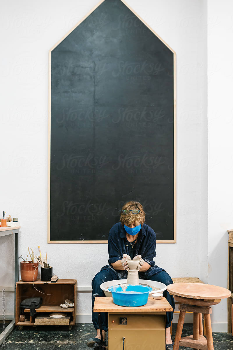 Woman working in spacious crockery workshop