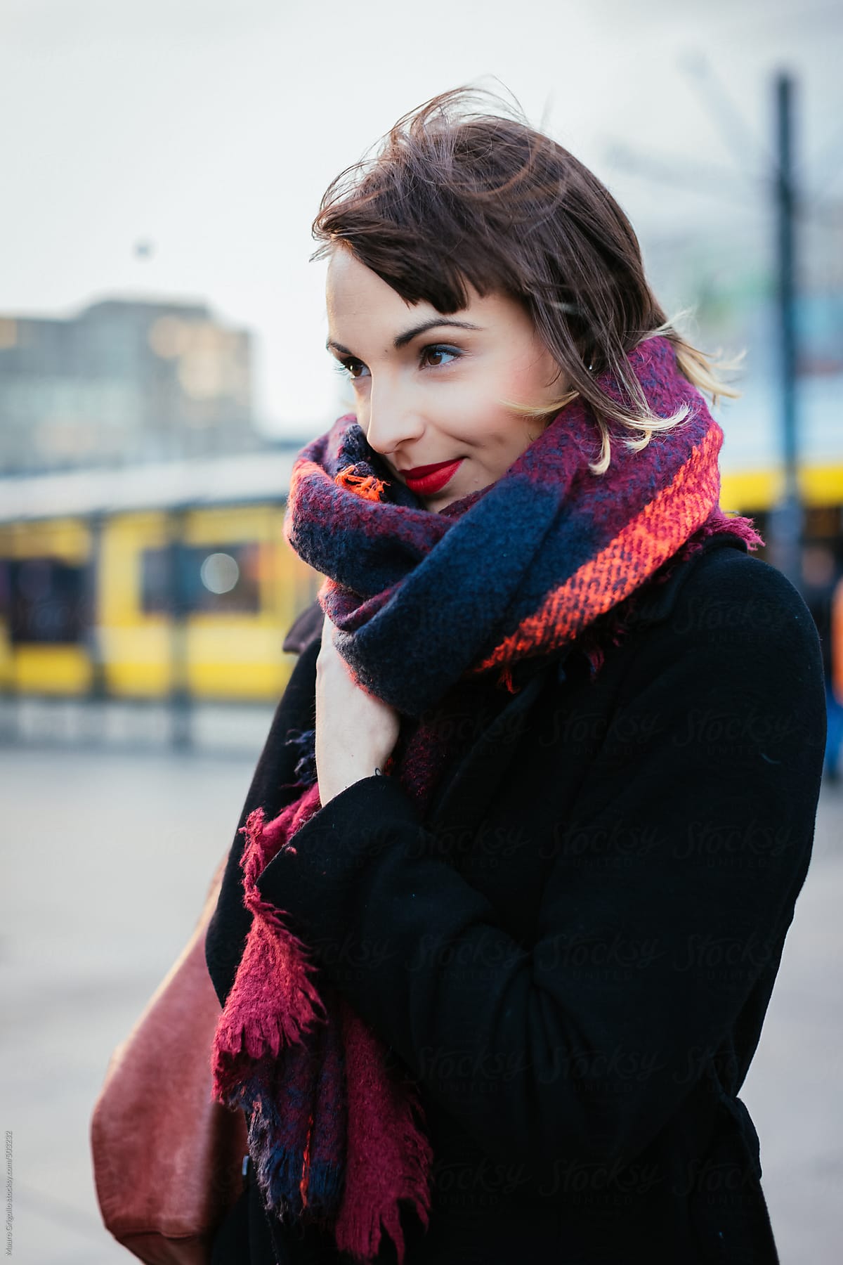Serene Woman walks in the city during winter