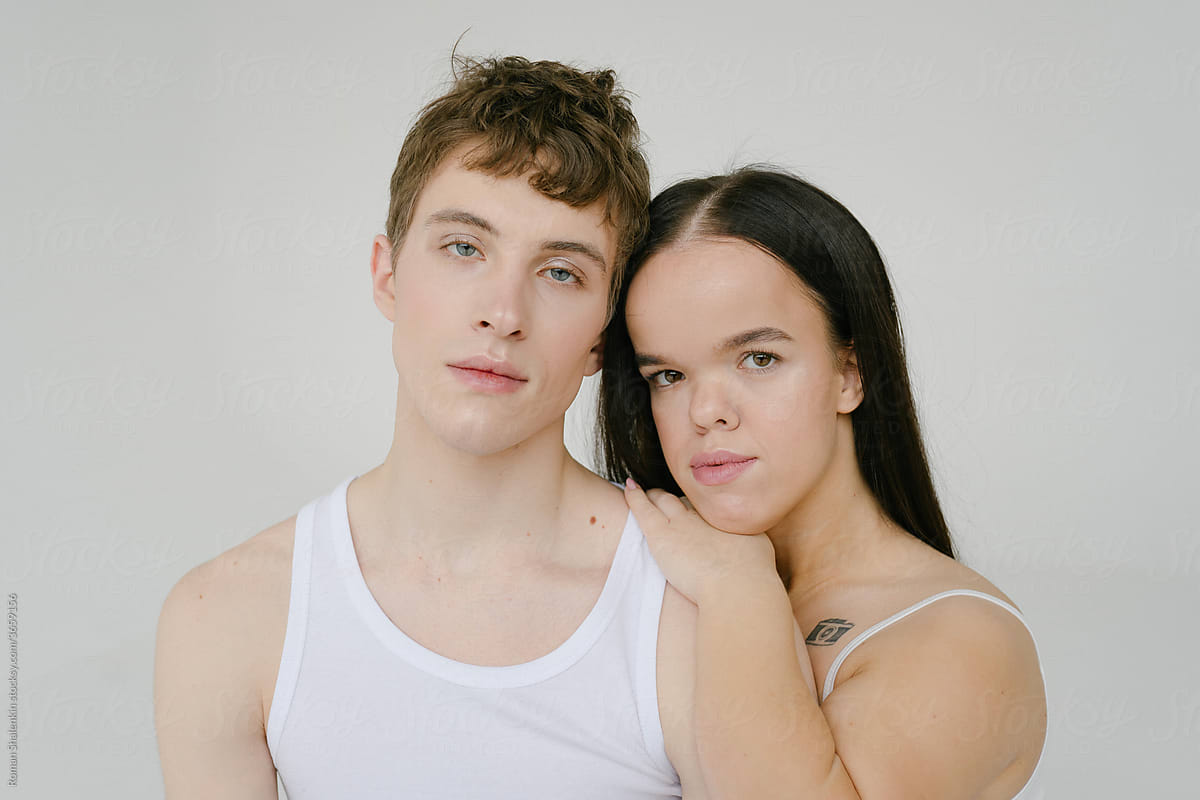Androgynous man and Young dwarf woman in studio