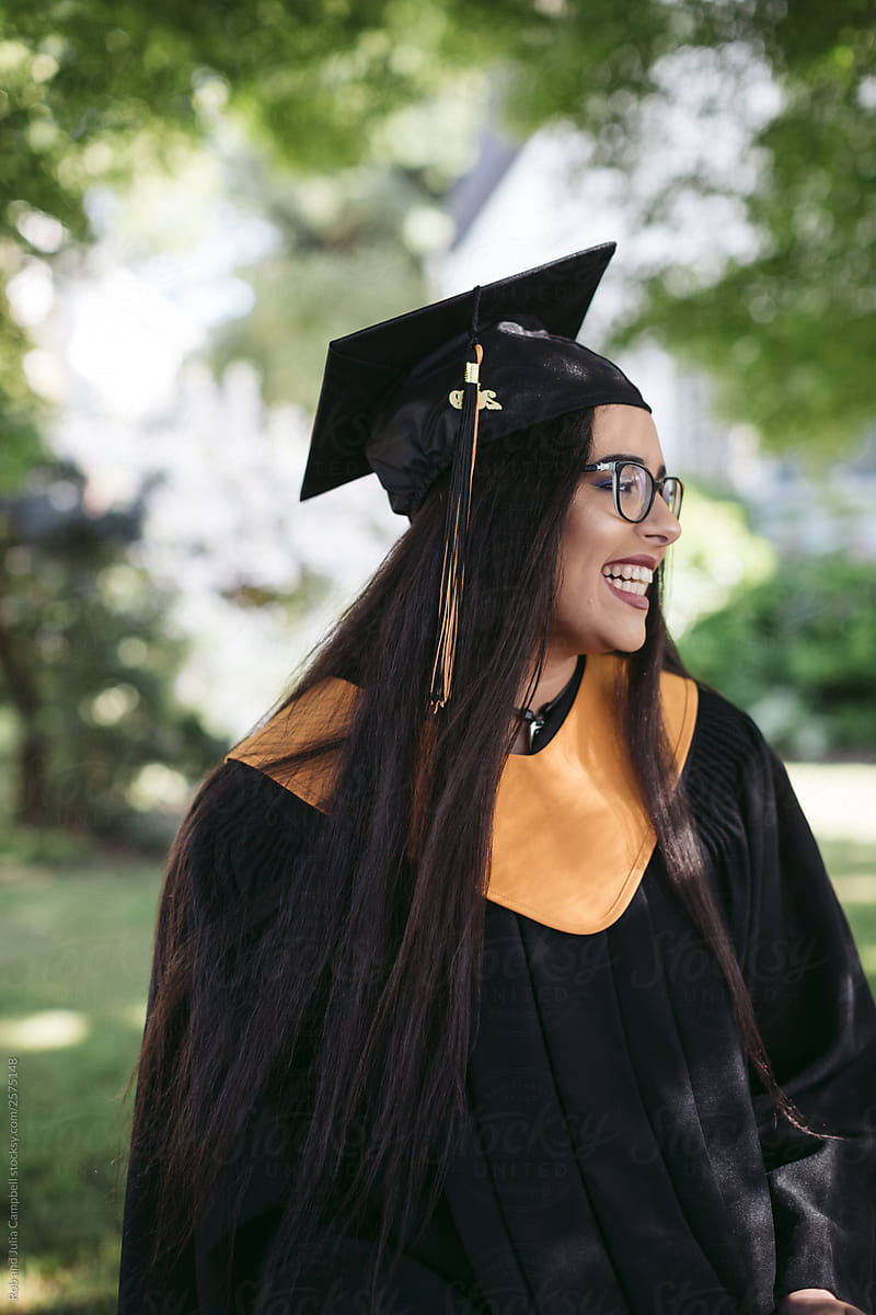 Teenage girl in cap and gown costume.