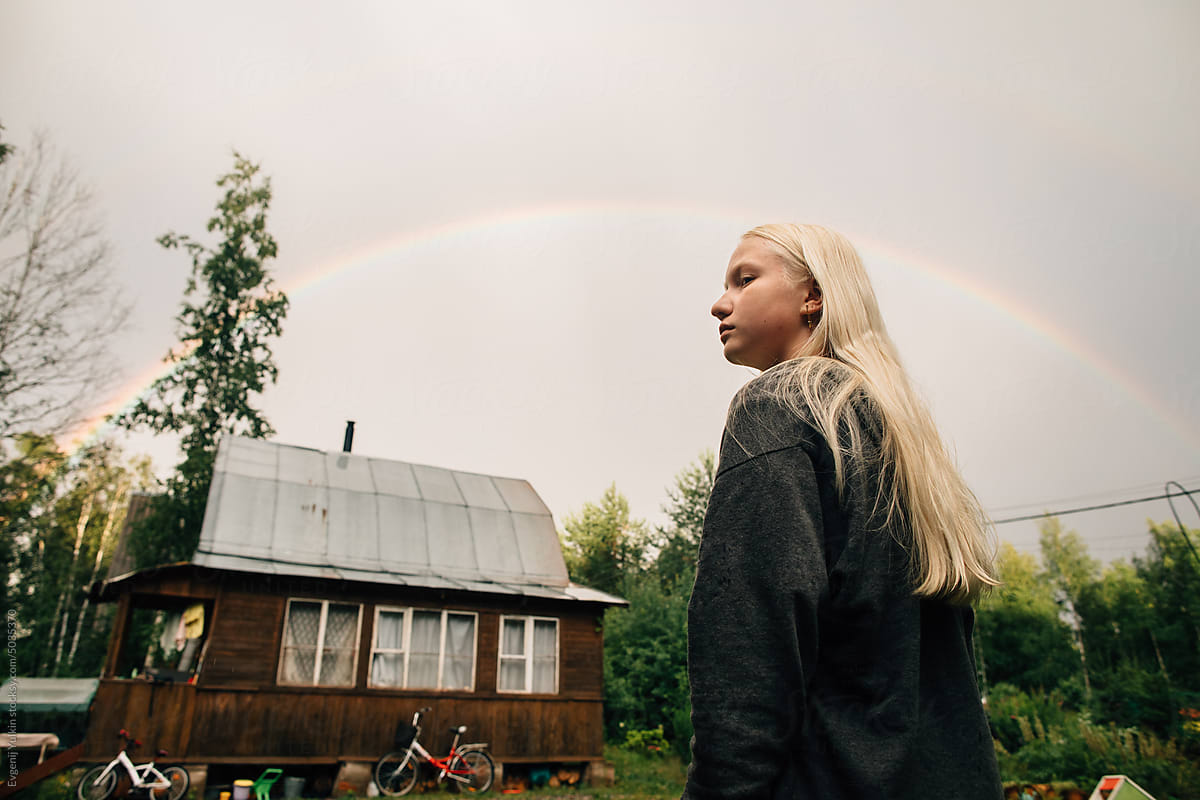 Teen girl and rainbow