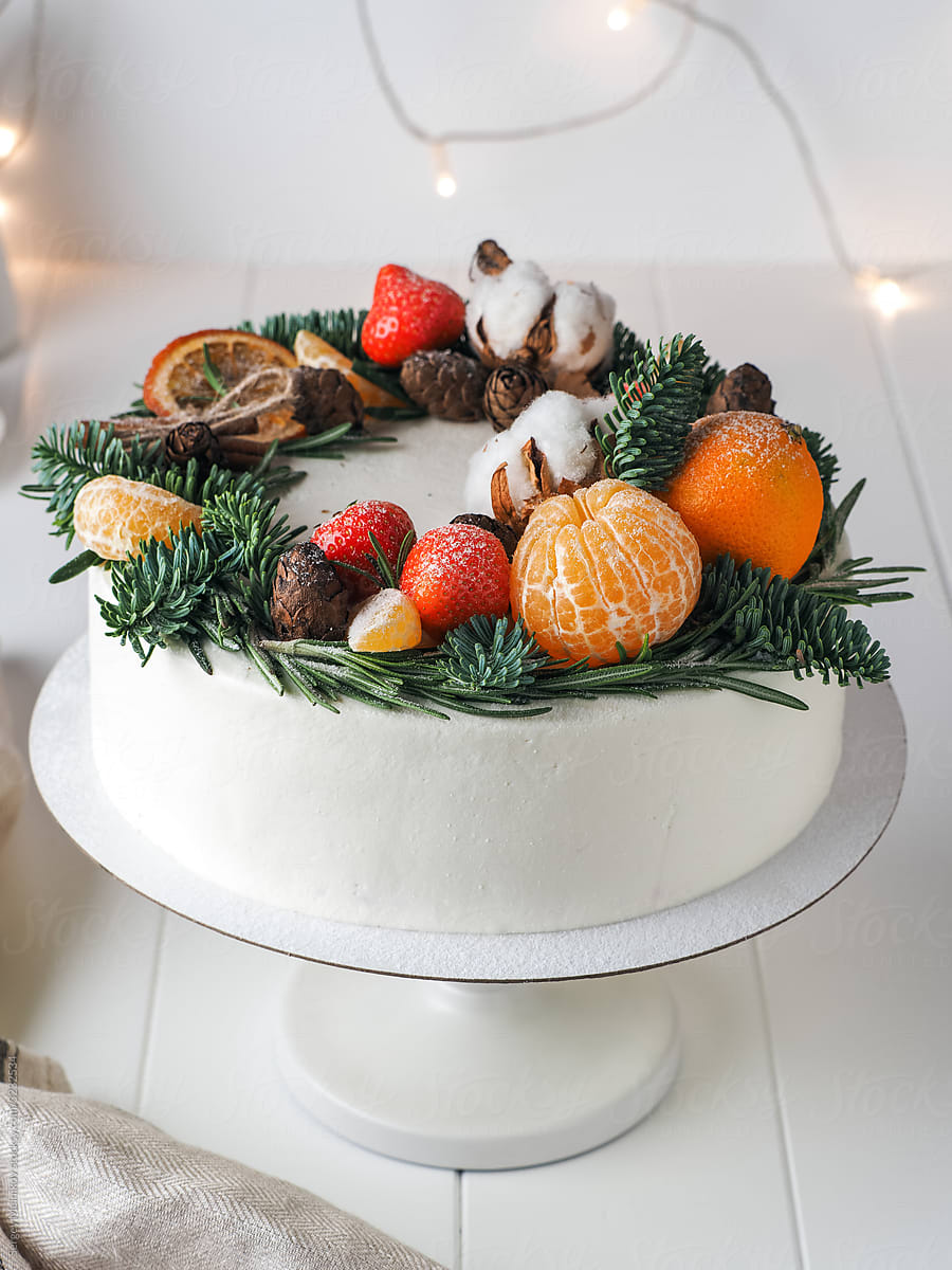Festive Christmas cake decorated with fruits and berries