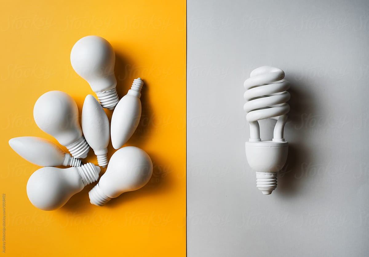 Classic and economic light bulbs against each other.