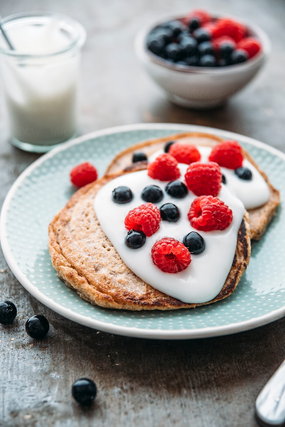 Food: vegan pancake with coconut yogurt and berries