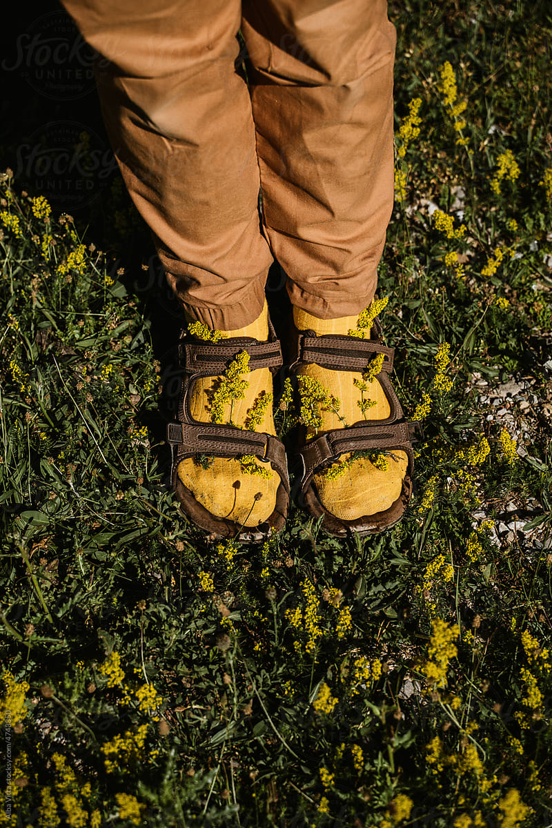 Man wearing socks with sandals with flowers