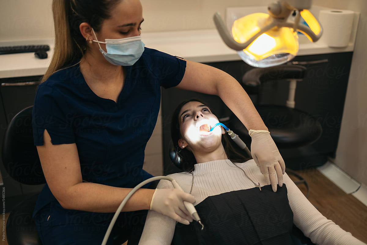 Dentist And Patient During A Dental Intervention