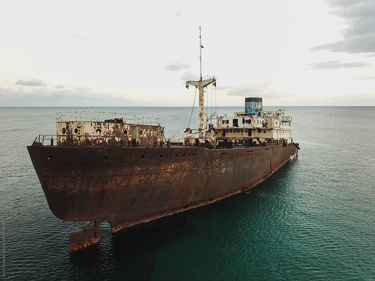 Abandoned Rusty ship on ocean
