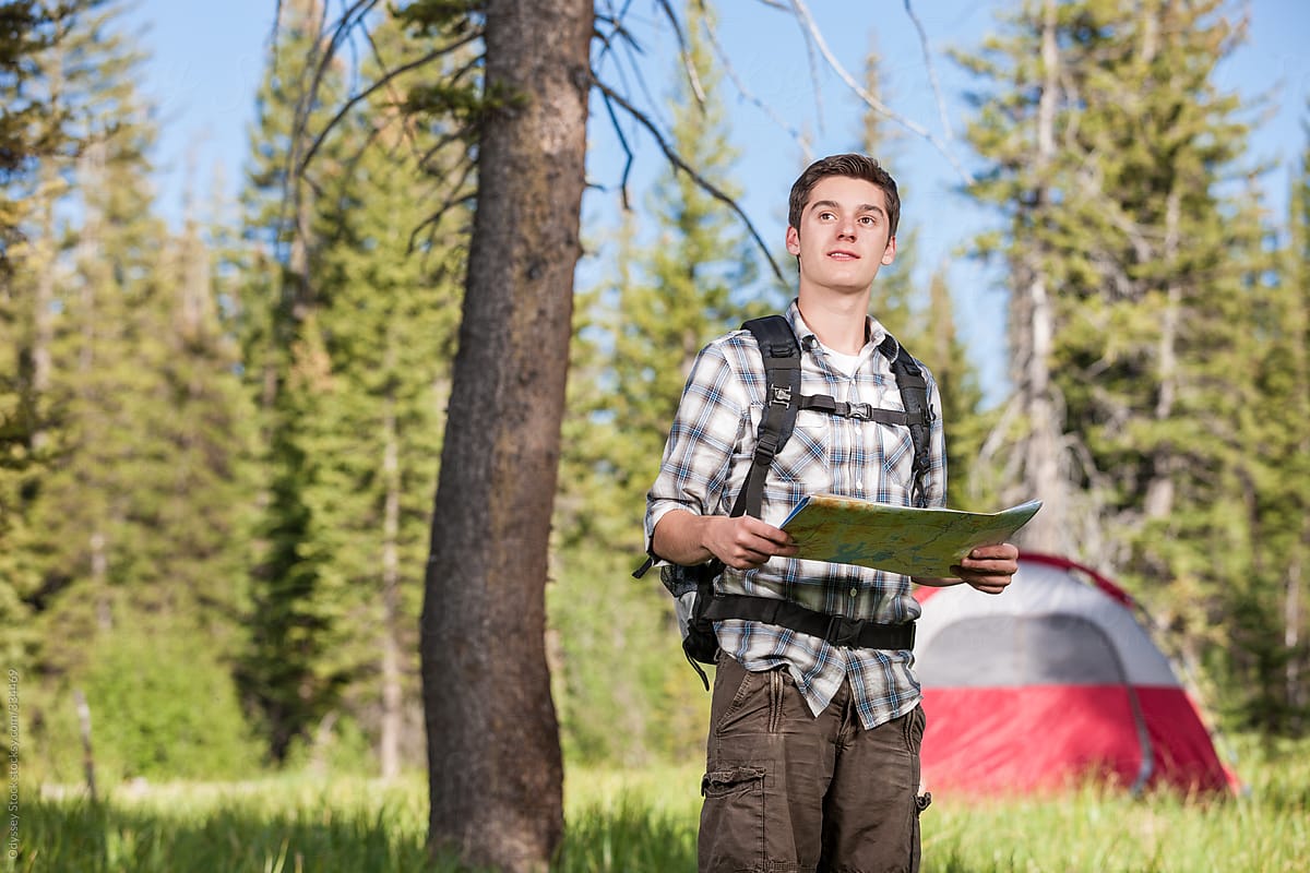 Teenage Boy Using Map While Camping