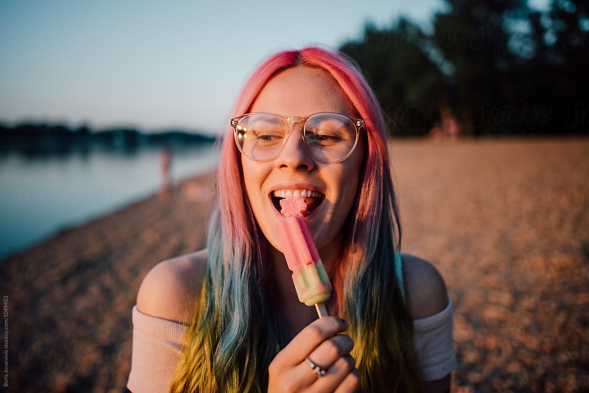 Young Woman Eating Ice Cream Outdoor By Stocksy Contributor Boris Jovanovic Stocksy 5658