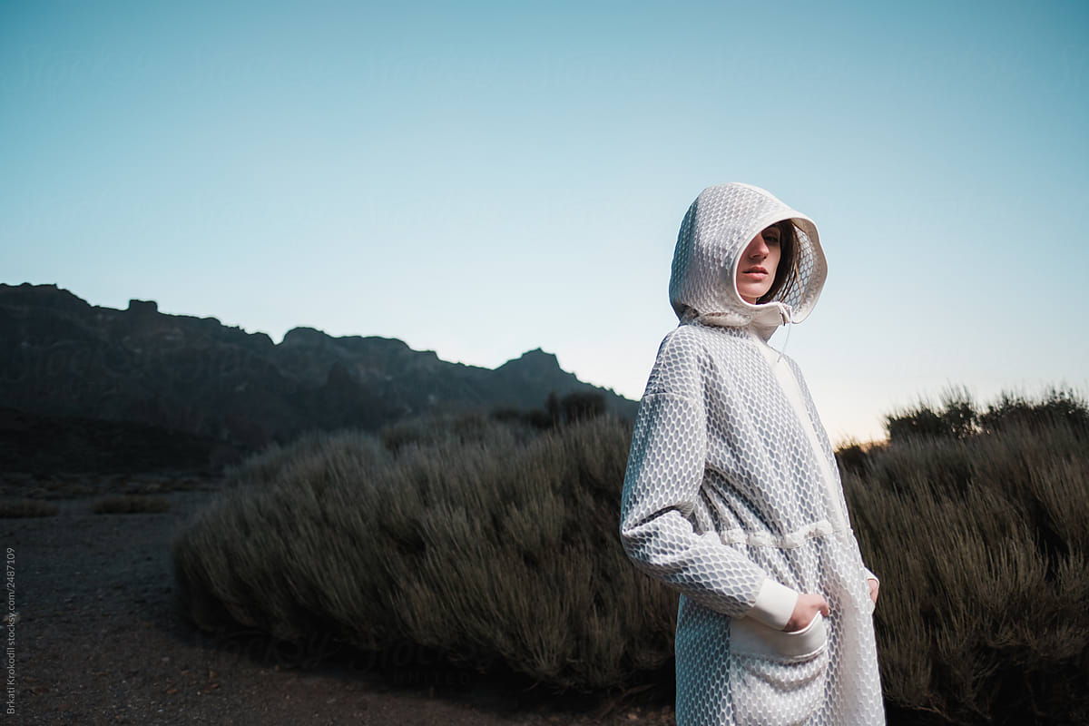 Female Model Wearing Futuristic White Coat With Hood