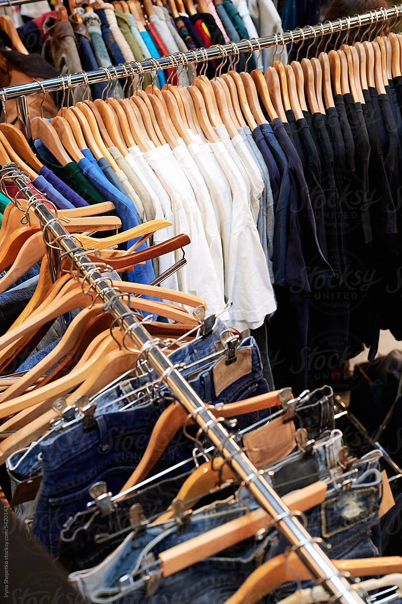 Hangers with clothes, vintage flea market, second-hand clothing
