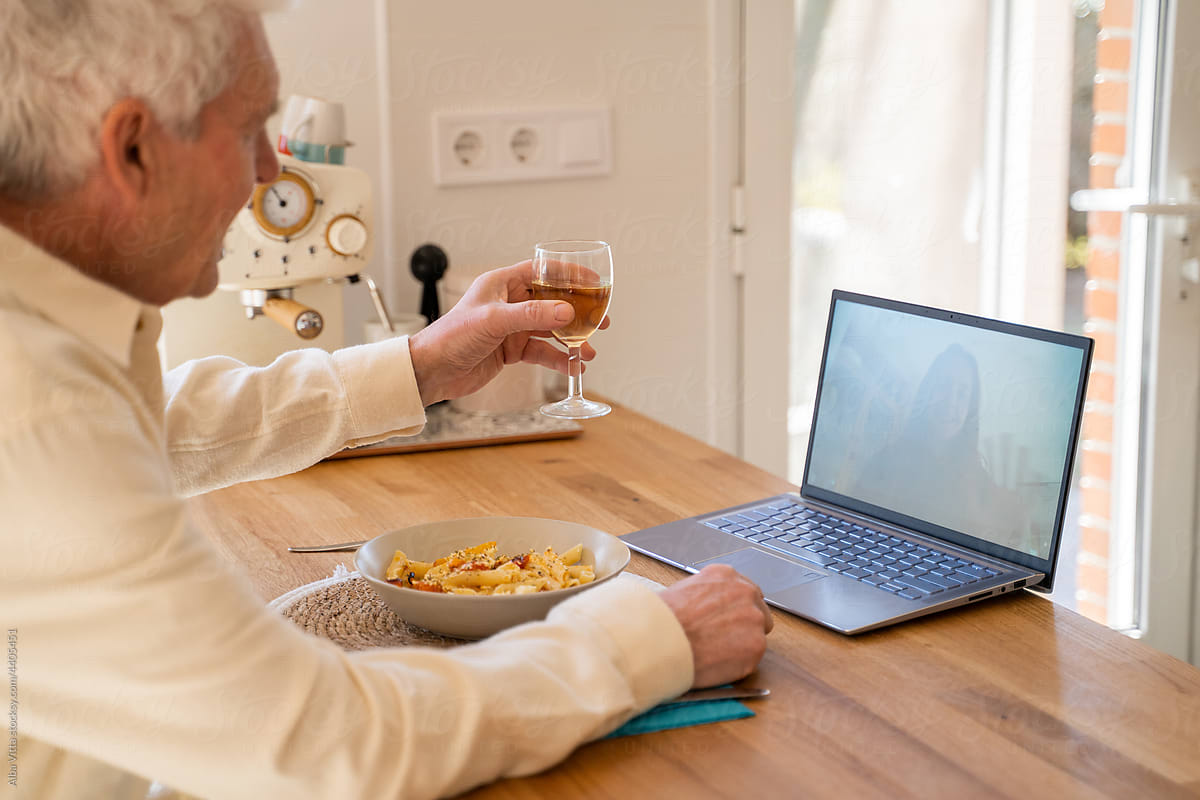 happy Senior man making videocall  making a toast