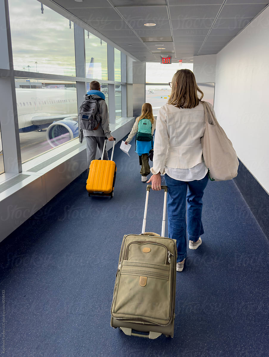 Family UGC travel walking together  Airport with luggage in terminal
