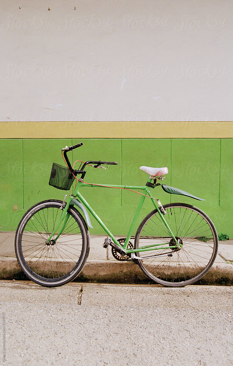 Green Bicycle Against Green Wall