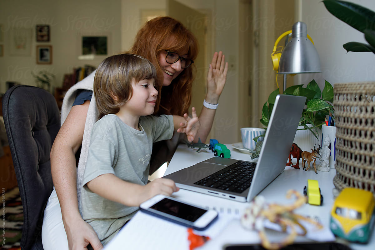 Mom and son talking online at home