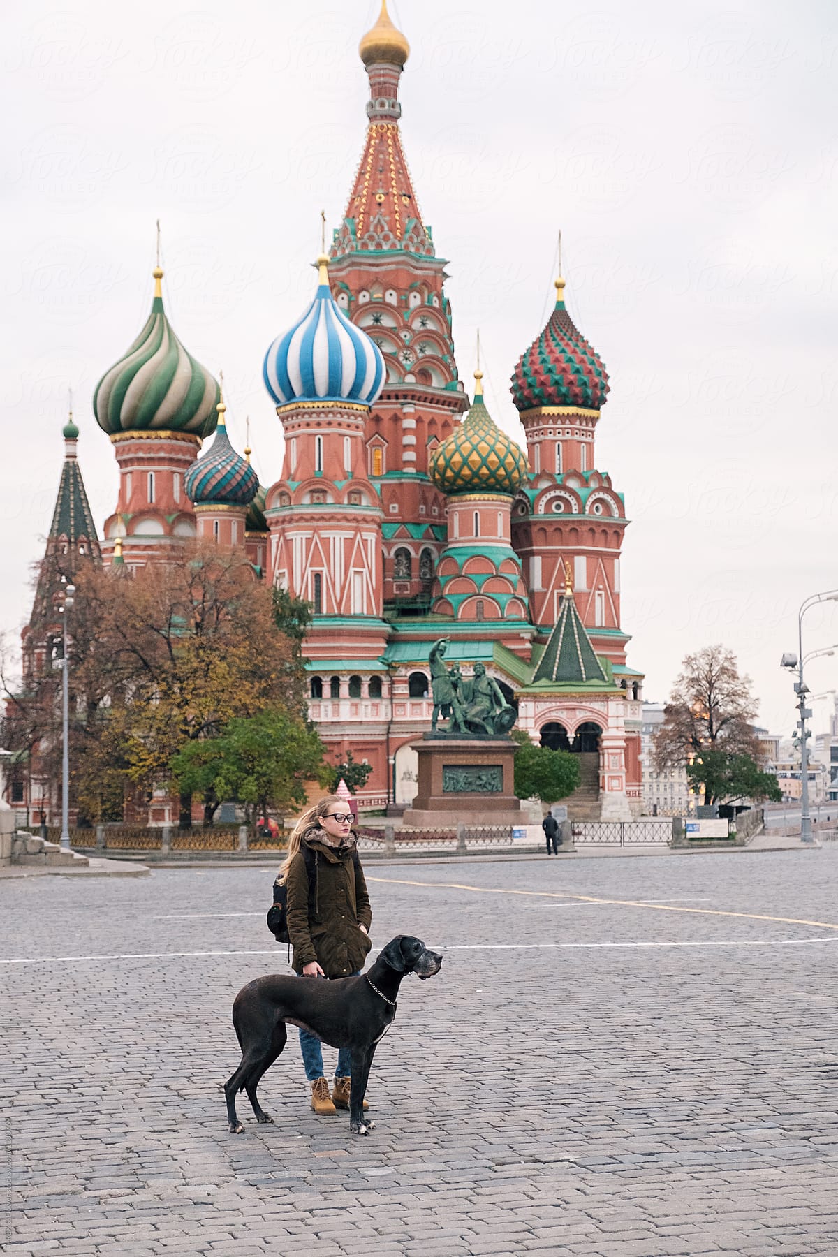 Attractive woman with dog. Red Square