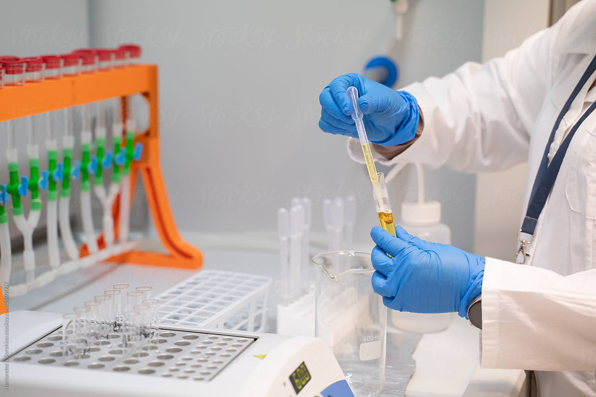 Anonymous Researcher Working At Chamber In Laboratory