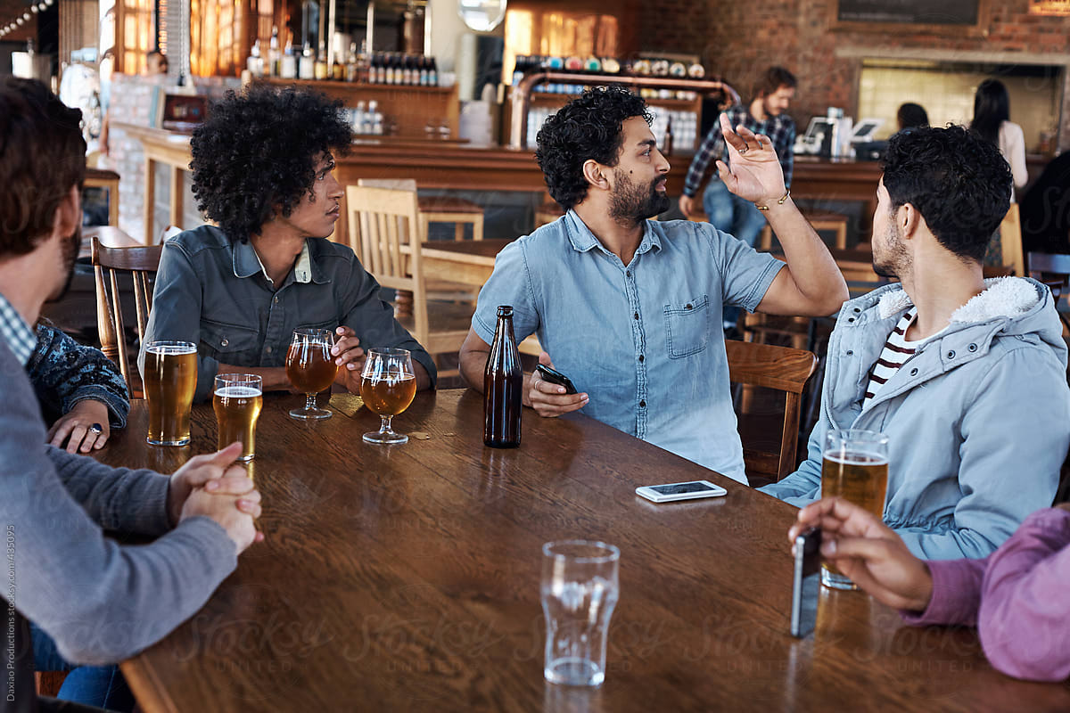 Diverse group of friends enjoying beers together