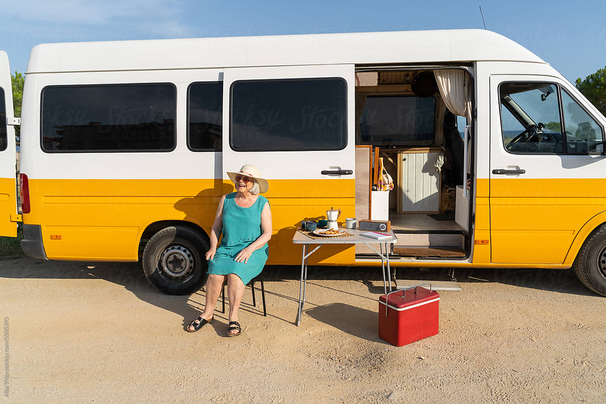 Retired woman summer holidays in camper van