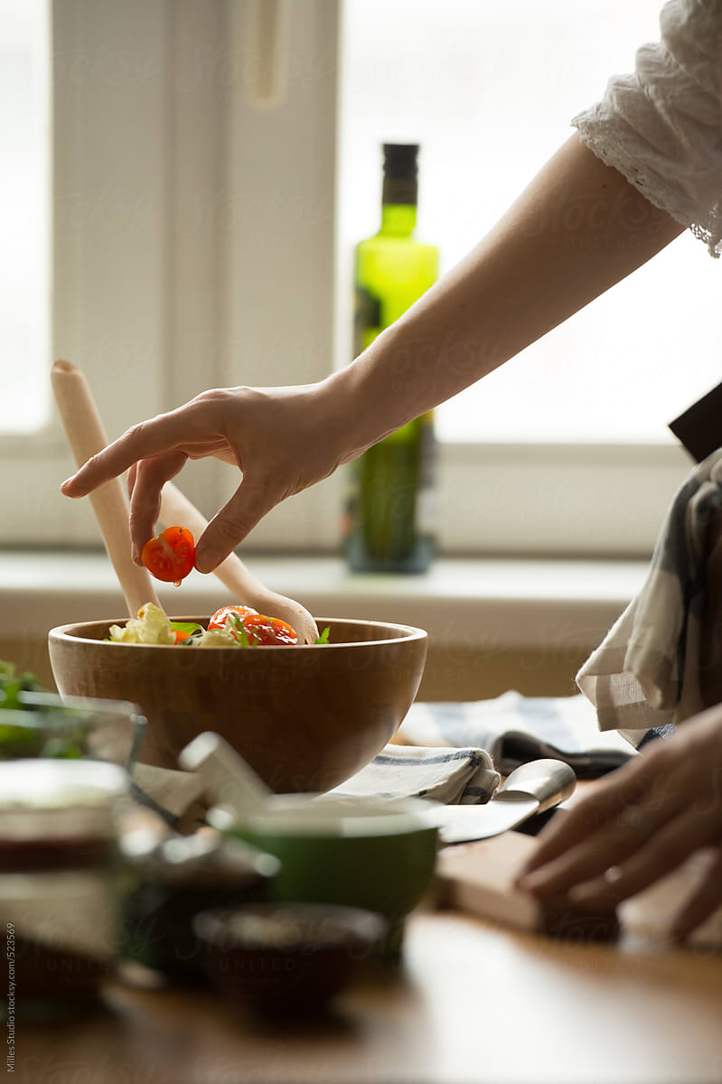 Female Hands Cooking Vegetables Salad by Milles Studio