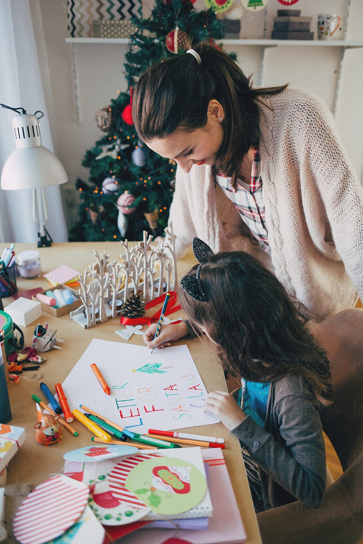 Mother and Daughter Writing a Letter to Santa