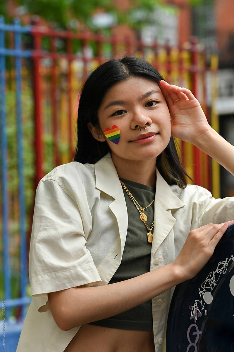 Young woman with rainbow for pride