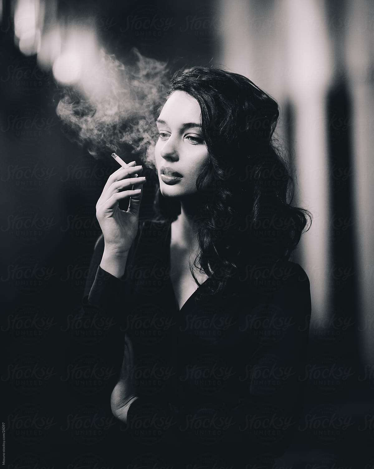 Beautiful woman posing with a cigarette.