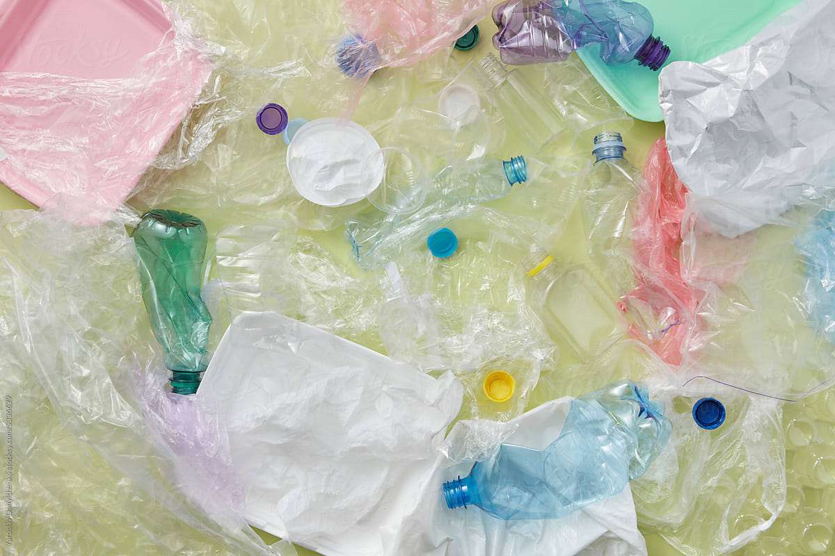 Various plastic, paper and glass waste.
