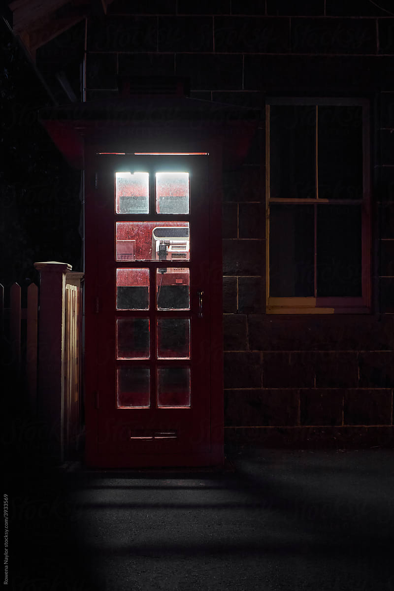 Public phone box at night