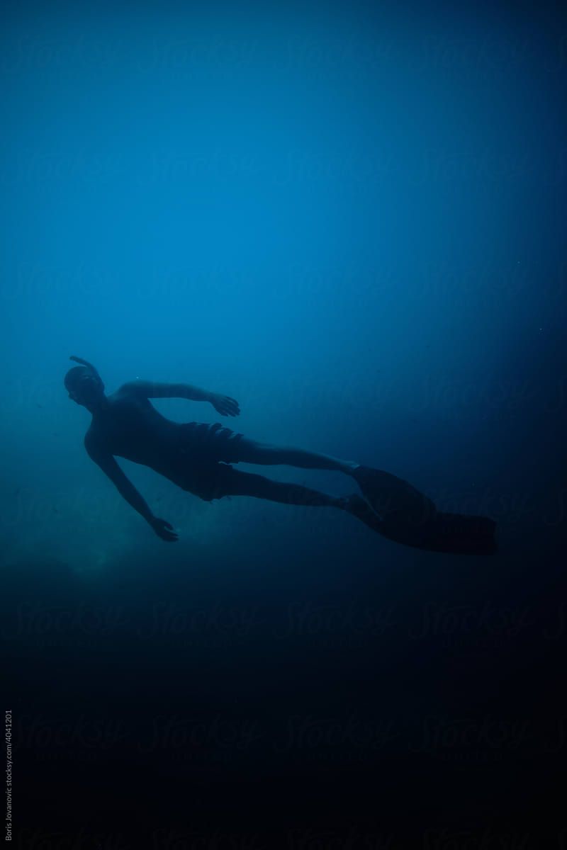 Snorkeling Diver In The Sea
