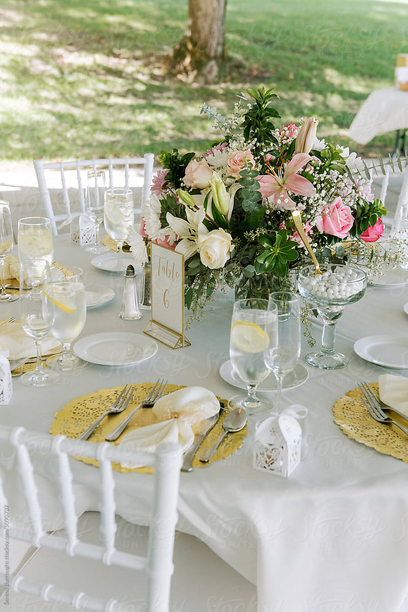 Tabletop with a bouquet, glasses and cutlery at a wedding