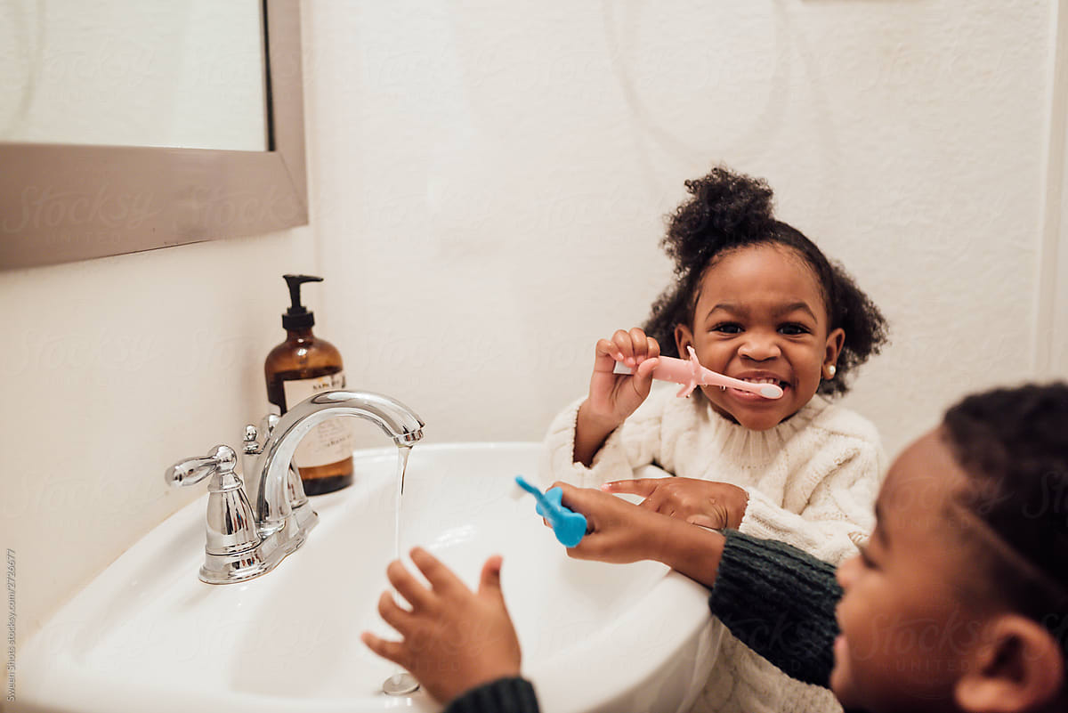 Brother And Sister Brushing Teeth In Bathroom By Stocksy Contributor 